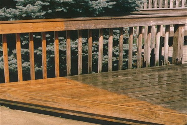 Wood deck showing before and after the cleaning process.