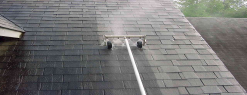 a tool rooling up the roof cleaning it
