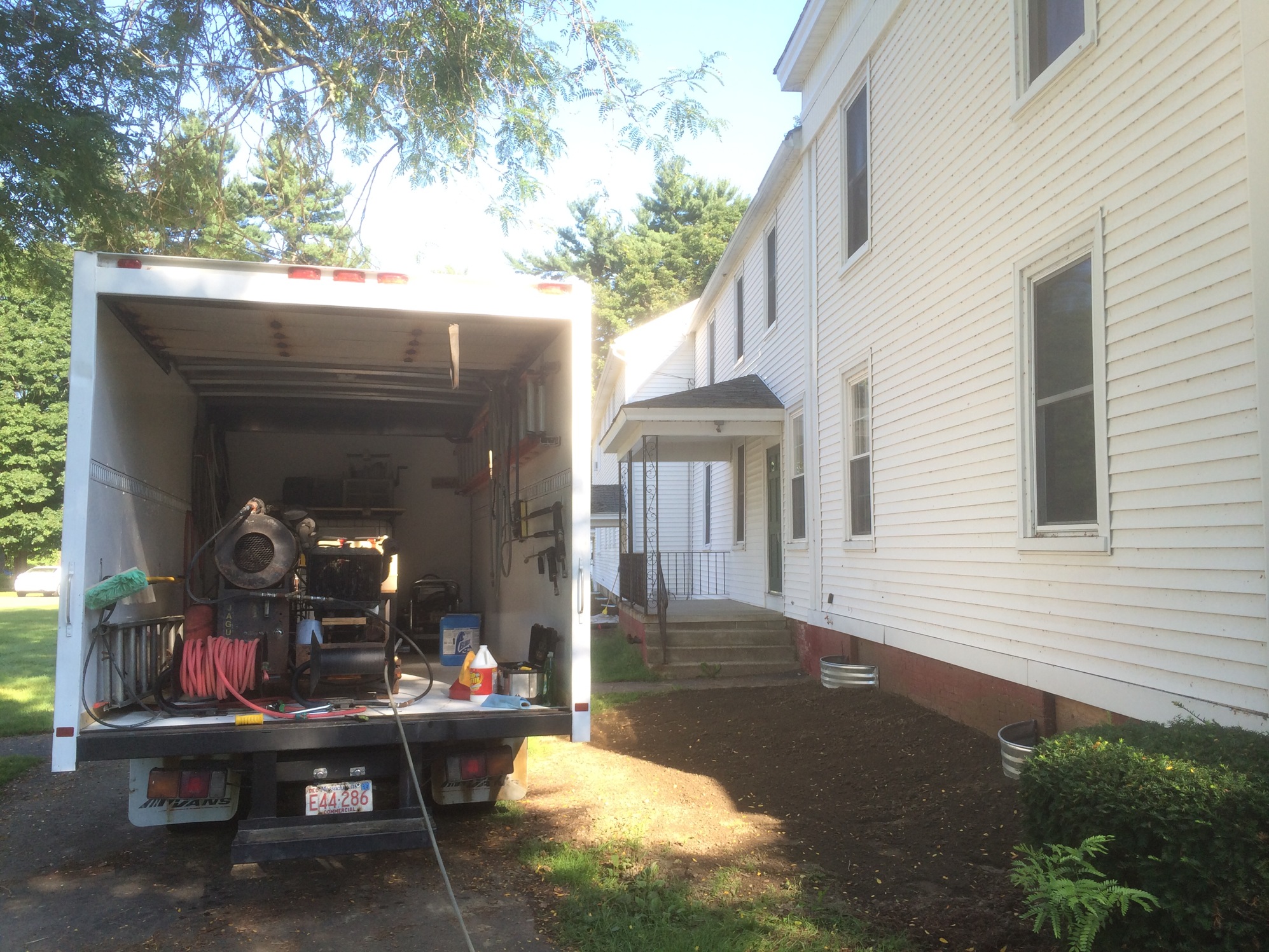 pressure washing inside a box truck
